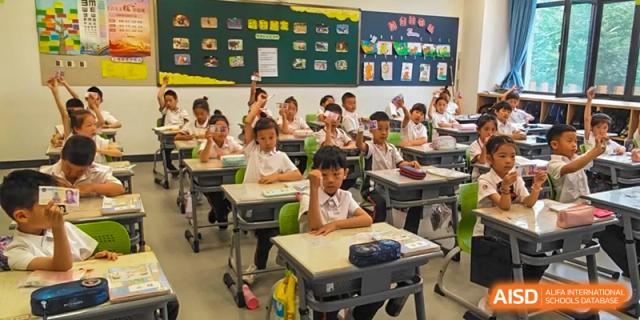 Students from Beijing Lize International Academy collaborate in a classroom setting.