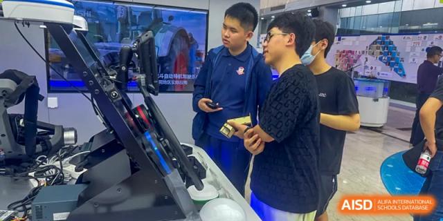 Two students from Beijing Lize International Academy play a video game.