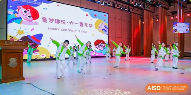 Students from Beijing Lize International Academy dancing on a stage in a group performance.