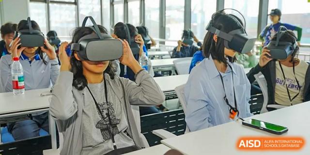 Students wearing virtual reality headsets in a classroom at Beijing Mingcheng Academy.