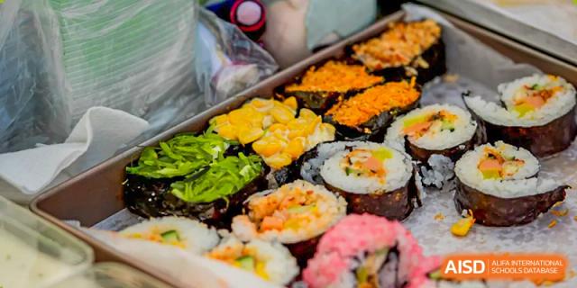 A tray of assorted sushi rolls at Beijing Mingcheng Academy.