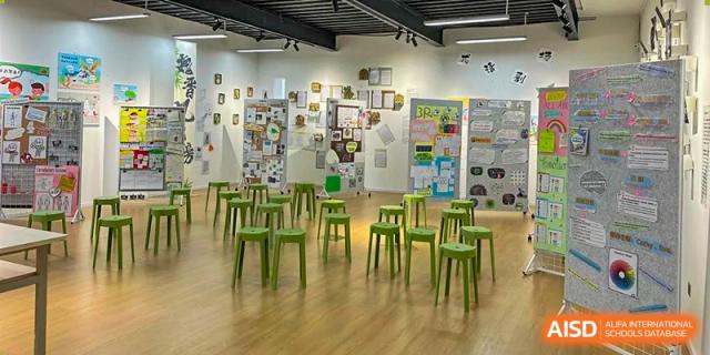 A classroom at Kunming Concord College of Sino-Canada (CCSC) with green chairs and a bright, modern feel.