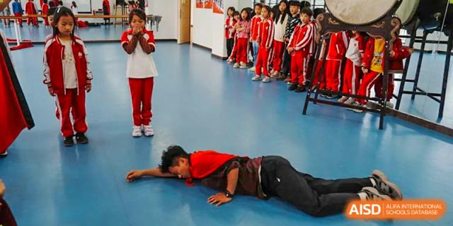 A young student from Kunming Concord College of Sino-Canada (CCSC) is seen lying on the floor during a first-aid training simulation.