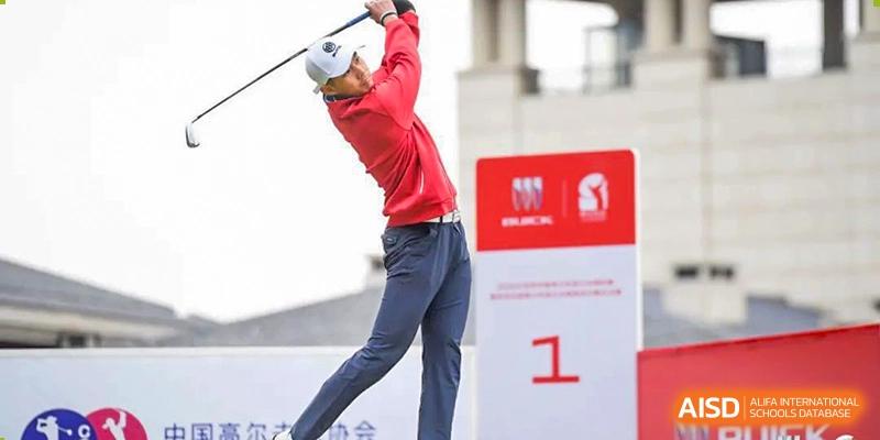 A student from Shanghai International High School of BANZ playing golf and taking a swing.