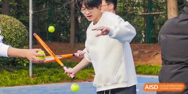 A student from Shanghai International High School of BANZ playing tennis.