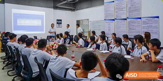 A classroom of students from The Affiliated School of JNU for Hong Kong & Macau Students (ASJ Dongguan) are looking towards the front of the class.