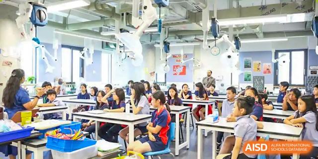 A group of students sitting at desks in a classroom at Yew Chung International School of Chongqing