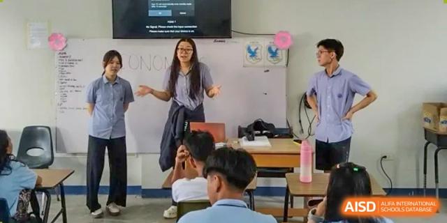 A teacher interacting with students during a lesson in a classroom at Yew Chung International School of Chongqing