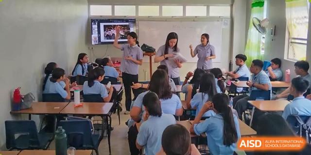 Students and a teacher participating in a group activity in a classroom at Yew Chung International School of Chongqing