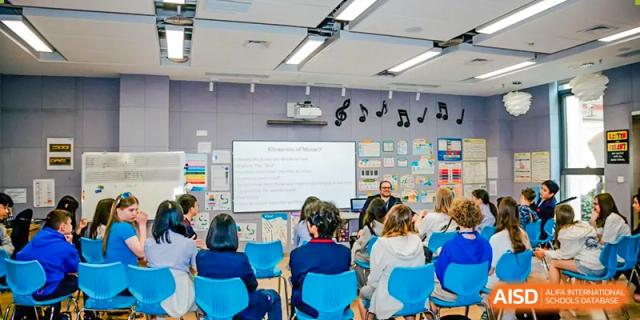 A group of students sitting in a music classroom at Yew Chung International School of Chongqing