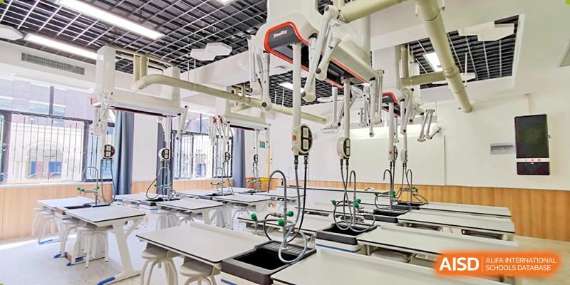 Modern laboratory equipment, including sinks and suspended fixtures, showcasing facilities at Yiwu International Academy.
