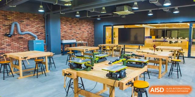 A woodworking or technical workshop with tools and workbenches, representing a practical learning area at Yiwu International Academy.