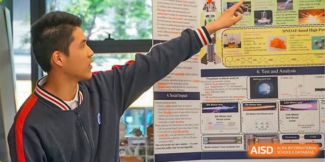 A student presenting a large poster detailing a project, with a hand pointing to the text at BASIS International School Hangzhou (BIHZ).