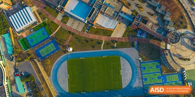 An aerial view of the soccer field and running track at Qingdao No.1 International School of Shandong Province (QISS).
