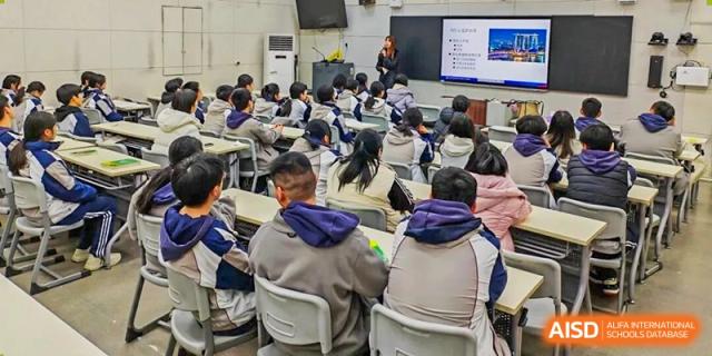 A view from the back of the classroom showing Zhengzhou No.9 High School International Department students engaged in a lesson.