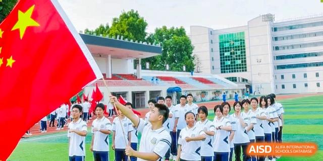 Zhengzhou No.9 High School International Department students participating in an outdoor activity or assembly on the school grounds.