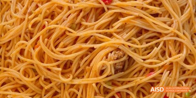 A close-up of a plate of spaghetti with a red sauce. Beijing No.4 High School International Courses Jialian Campus.