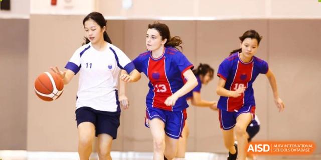Students running during an athletic competition or game at Yew Chung International School of Beijing.