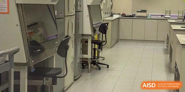 An image showing part of a specialized science laboratory with equipment and a lab stool at Wuxi Big Bridge Academy.