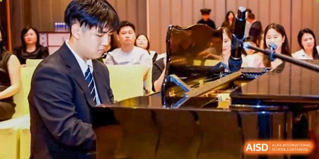 Students from Zhuhai Oriental Yinghua International Academy seated and engaged in a discussion or lecture in a classroom setting.