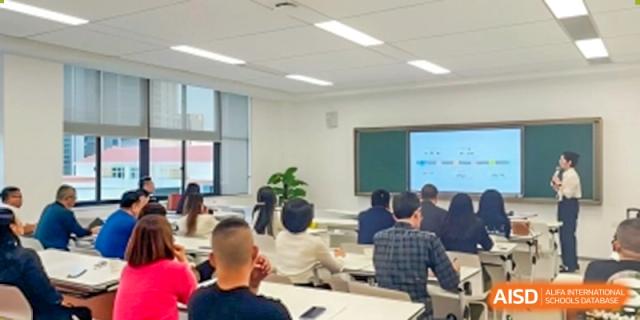 A class of students at Maple Glory Education seated in a bright classroom, facing the front.