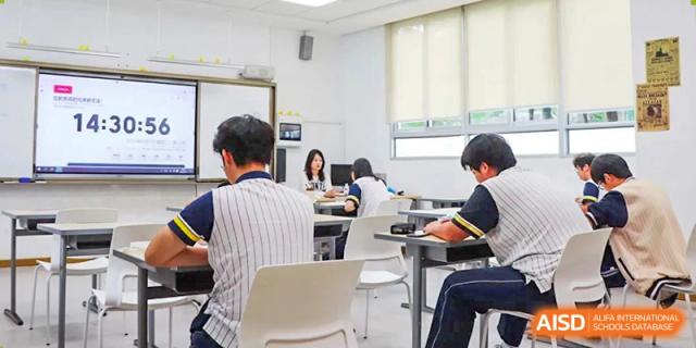 Students at Maple Glory Education working individually at desks in a well-lit classroom.