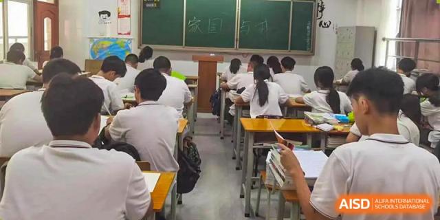 A classroom filled with students sitting at their desks during a lesson or exam at Oxstand International School, Shenzhen.