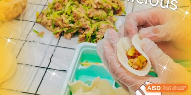 A close-up of hands, wearing gloves, crimping the edges of a dough wrapper to form a dumpling during a food preparation activity at Oxstand International School, Shenzhen.