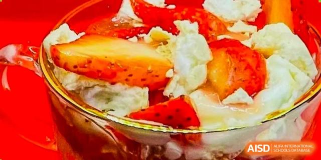 A close-up of a healthy food item, likely a fruit salad with strawberries, to represent the Health & Nutrition program at Shanghai Livingston American School.