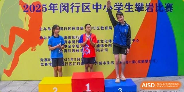 Two female students standing on a winners' podium after a school sports competition, celebrating their victory at Shanghai United International School (SUIS-Jiaoke) Jiaoke Campus.