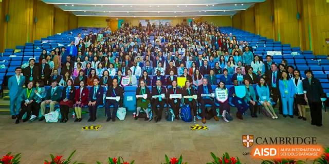 A very large group of students and teachers gathered for a conference or event indoors at Suzhou Science and Technology Town Foreign Language High School.