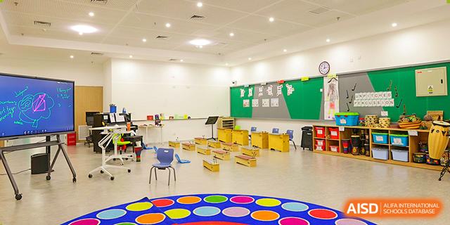 A colourful and organized kindergarten classroom at Dehong Beijing International Chinese School, ready for young students.