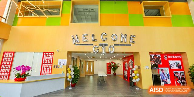A vibrant reception area at Dehong Beijing International Chinese School decorated with a "WELCOME GTO" sign and balloons.