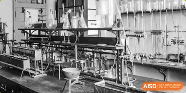 A black and white photograph showing historical laboratory equipment and glassware used for scientific research at Zhongshan Sanxin School International Department.