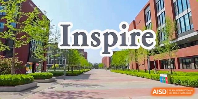 A wide shot of the school's paved walkway between brick buildings is overlaid with the large motivational word "Inspire" at Beijing Chaoyang KaiWen Academy.