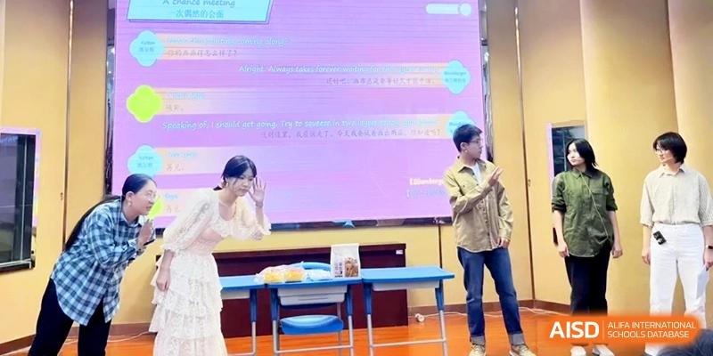 Two students give a presentation on stage in front of a purple digital screen at the Attached Senior School Of Shandong Normal University.