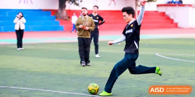 A student demonstrates his soccer skills during a game on the school’s turf field at the Attached Senior School Of Shandong Normal University.