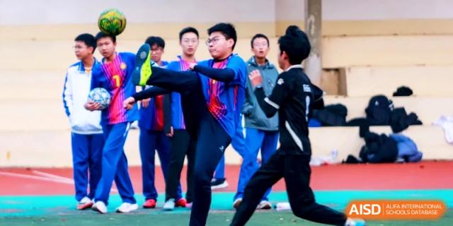 Students participate in a physical education class or sports drill on the field at the Attached Senior School Of Shandong Normal University.