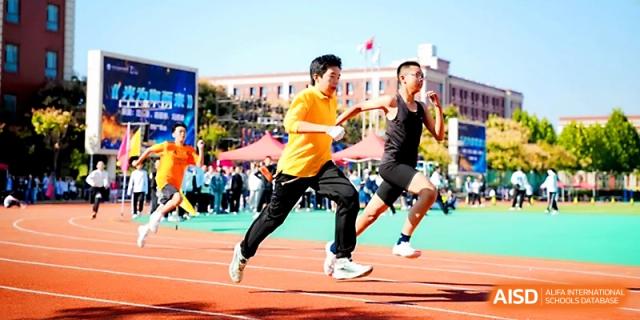 Athletes compete in a fast-paced sprinting event during an outdoor athletic competition at Wuhan Guanggu Future School.