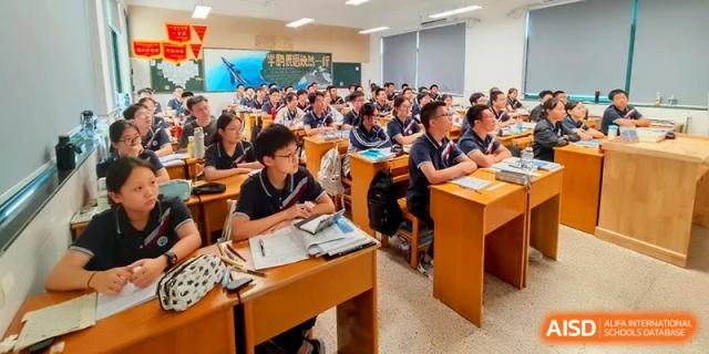 A high-angle view of a classroom full of students during a focused academic lesson at Changzhou Senior High School of Jiangsu Province.