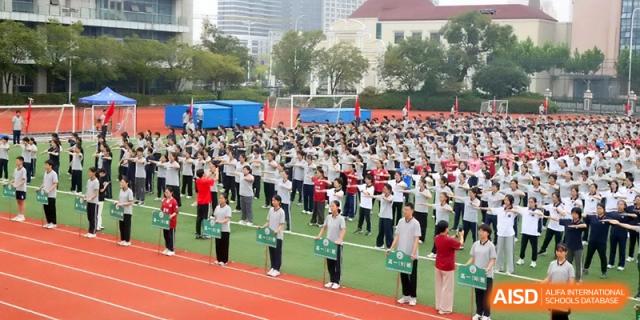 An aerial view of students lined up in perfect rows for a morning assembly on the sports field at Changzhou Senior High School of Jiangsu Province.