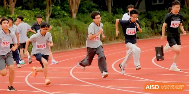 Two male students compete in a fast-paced sprint on the school’s red athletic track at Changzhou Senior High School of Jiangsu Province.